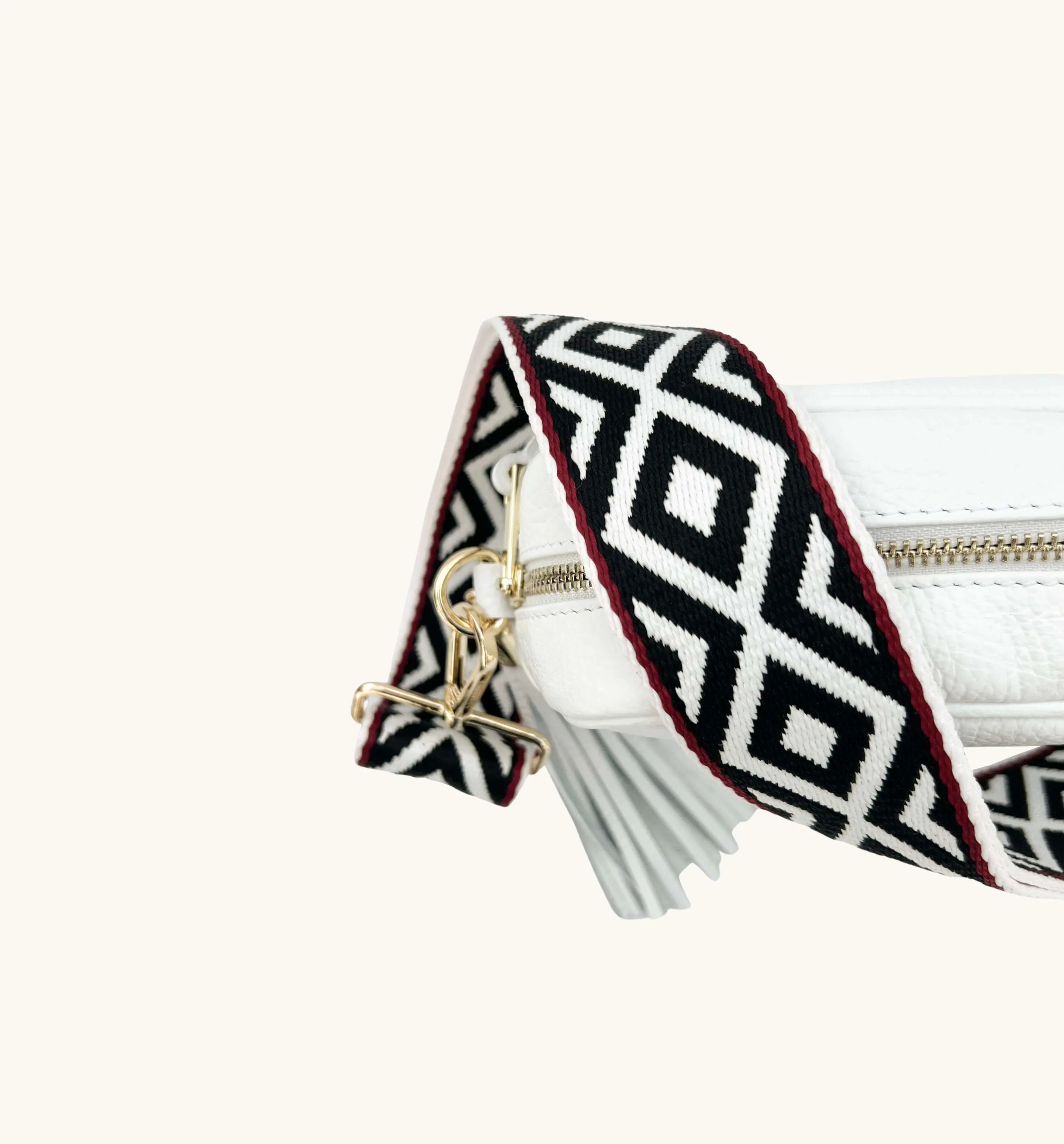 The Tassel White Leather Crossbody Bag With Black & Red Aztec Strap